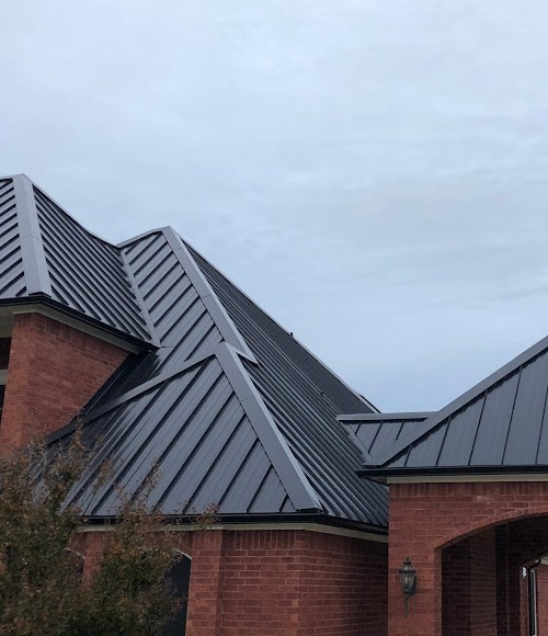 New metal Roof on a large brick home